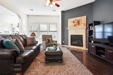 The large family room will be the center of your entertaining, featuring beautiful hand scraped wood floors and a stunning stone gas fireplace.