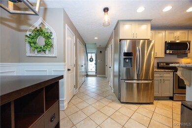 Kitchen featuring light tile patterned floors, rec