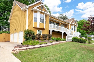 View of front of home featuring covered porch, sta