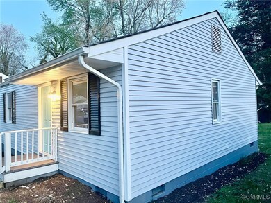 View of side of home with crawl space