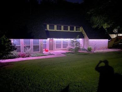 View of front facade with a lawn
