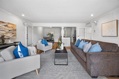 Living room with recessed lighting, visible vents,
