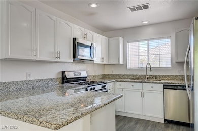 Kitchen featuring appliances with stainless steel