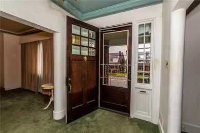 BEVELED GLASS IN THIS STATELY ENTRY DOOR WITH BEVE