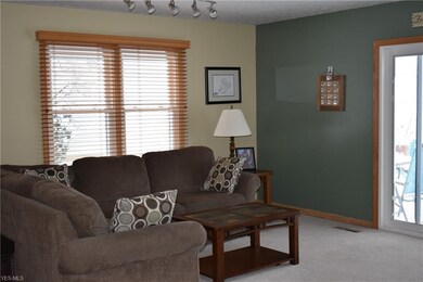 Lovely great room with access to the backyard patio! Decorated in neutral tones!