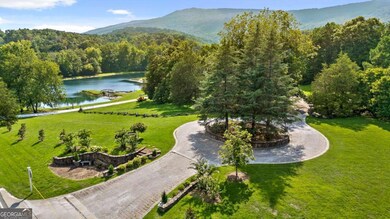 Front gate with view of Cloudland Station's Lake Angela.