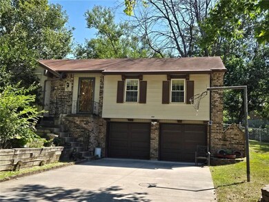 View of front of property with a garage