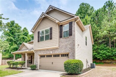 Brick Front House Featuring Front Covered Porch, Garage, Level Drive Way