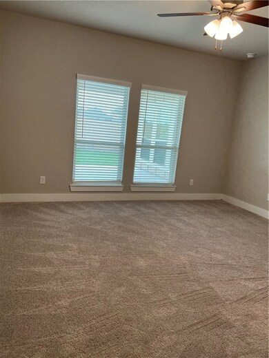 Carpeted spare room with healthy amount of natural
