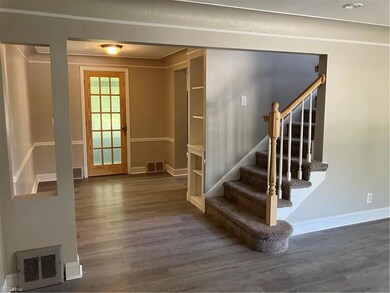 View from front door. Stairs to 2nd floor and door