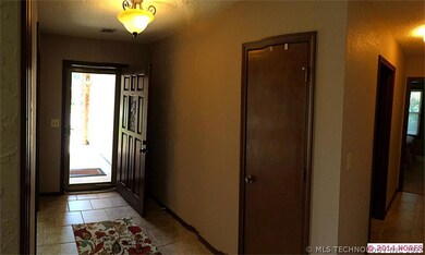 Entry to home with new lighting, tile and fresh pa