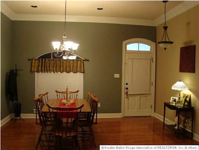 The Formal Dining Room and Foyer has beautiful rea