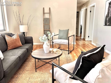 Living room with hardwood / wood-style floors