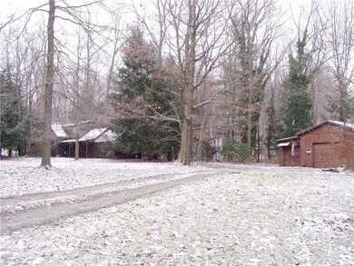 Exterior Front. Driveway, part od garage, shed