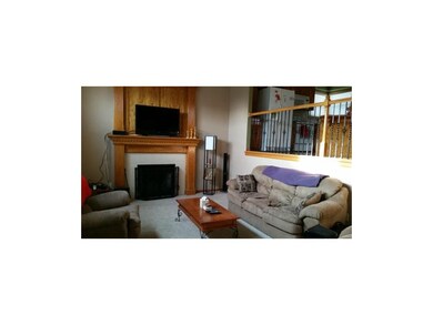 Living room with view to kitchen.