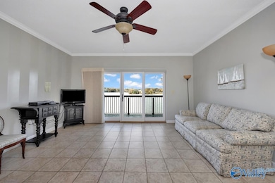 Tile flooring, ceiling fan, crown molding, plantation blinds