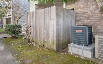 The 1.5 ton Goodman air conditioning unit sits on