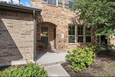 Doorway to property with brick siding