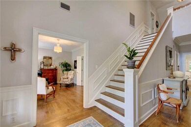 Looking from foyer into formal living/den.