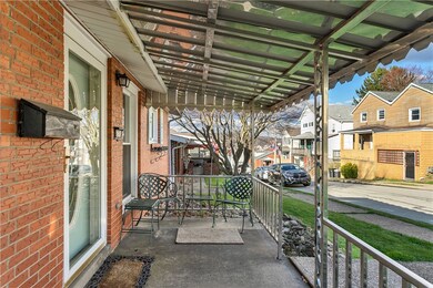 Relaxing covered front porch/patio.  Storm door an