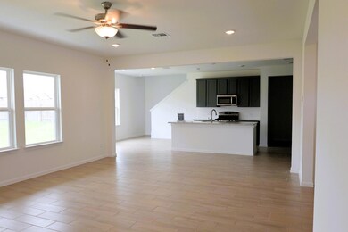 Unfurnished living room with a ceiling fan, reces