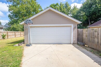 Garage with garage and a yard