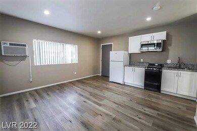 Kitchen featuring stainless steel microwave, gas s