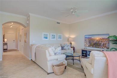 Living area featuring visible vents, ornamental mo