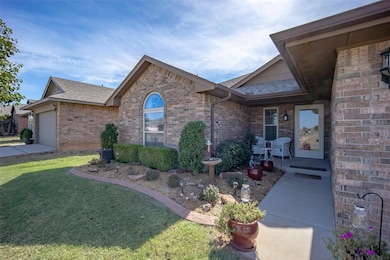 Ranch-style home with a front lawn and a garage