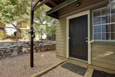 View of exterior entry featuring fence