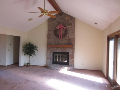 Floor to ceiling stone gas fireplace