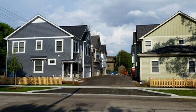 View of the Main Entrance. Homes on the left & rig