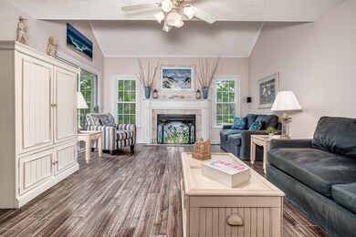 Vaulted living room w/ fireplace