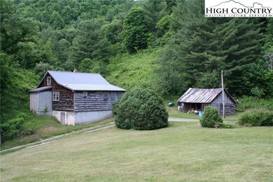 Main house and nearby log/frame woodshed