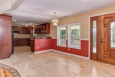 Kitchen opens to spacious dining room and exit to 