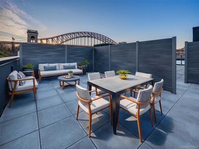 Patio terrace at dusk with fence, outdoor lounge area, and outdoor dining space