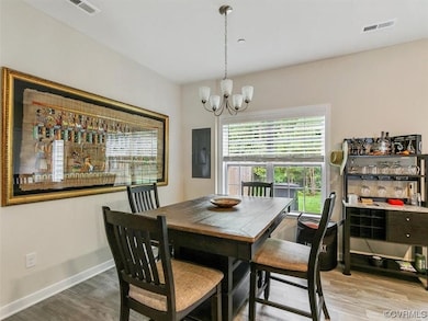 View of wood floored dining space