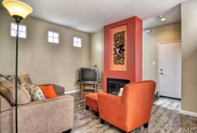 Family room with fireplace, beautiful floors, door