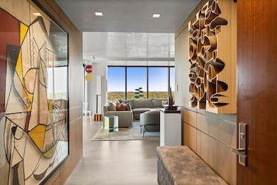 Fumed white oak panels detailed with brass inlay announce the home’s craftsmanship.