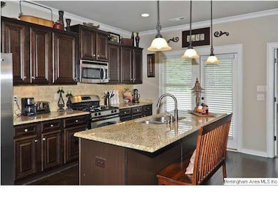 The beautiful kitchen featuring handscraped hardwo