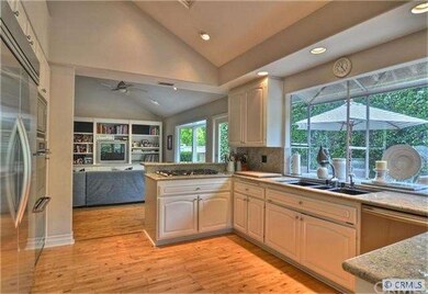 the kitchen is open to the family room
