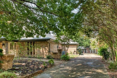Side driveway with electric gate to garage for security.