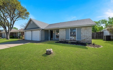 Ranch-style home with brick siding, driveway, roof with shingles, and an attached garage