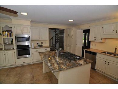 KITCHEN INCLUDES BUILT IN STAINLESS REFRIGERATOR A