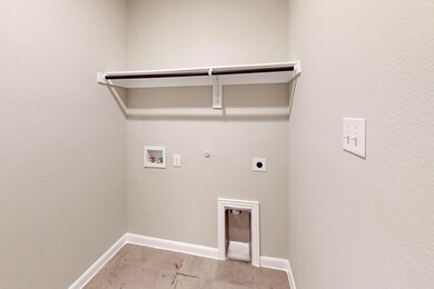 Washroom with hookup for an electric dryer, gas dr