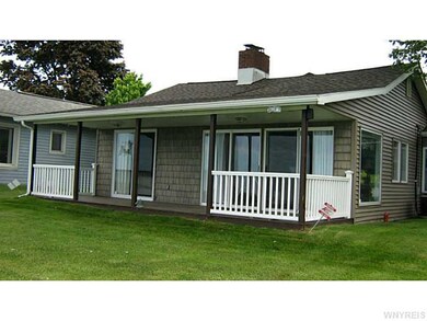Exterior Front. Another view of the porch on the l