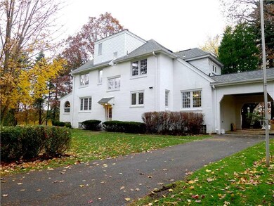 Exterior Back. A porte-cochere adds charm and conv