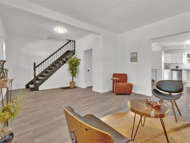 Living room moves right into eat in kitchen.  Great open floor plan makes this home perfect for entertaining.