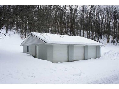 Partial Bath. There is a large three bay garage to