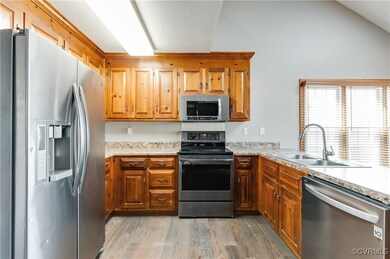 Kitchen featuring original cabinets, with stainles